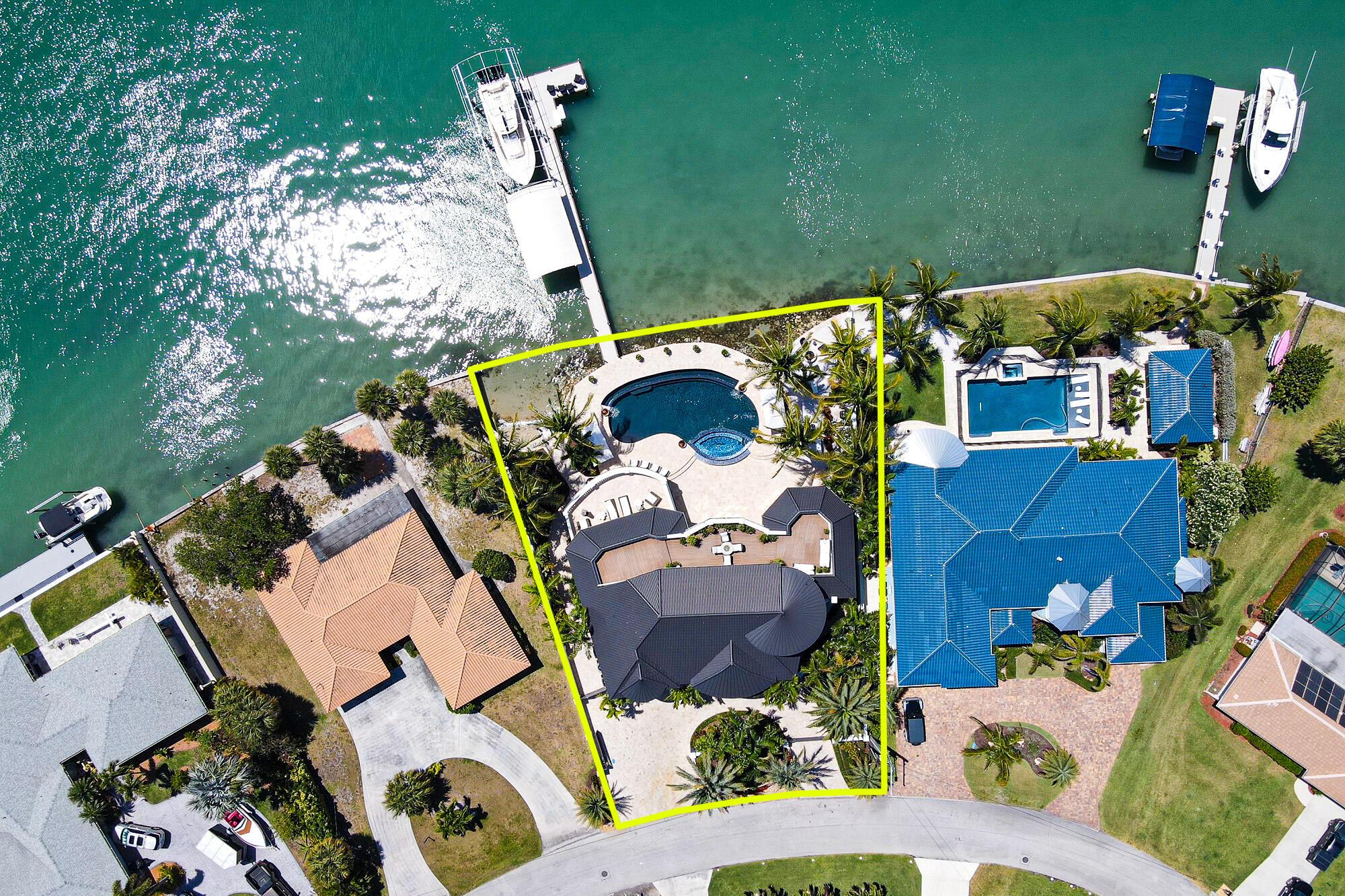 :AUCTION - Seller offering property via online auction. Bid online beginning Monday, January 13th with a starting bid of $2M. Preview weekend begins Friday, January 10 h to view this luxurious home matched with crystal clear water. Custom finishes in every area of this 3-story home are endless; from marble, quartzite, stone, glass, lighting, tech and much more. Breathtaking views of the Intracoastal Waterway and Indian River Lagoon make this a one-of-a-kind property. Approximately 105 ft in length, the custom dock with sitting area, lighting, WiFi and electric is equipped with 2 boat lifts. Relax by the spa/infinity pool with outdoor kitchen and entertaining area. Sold turnkey with designer furnishings. Visit Interluxe Auctions for full terms and conditions