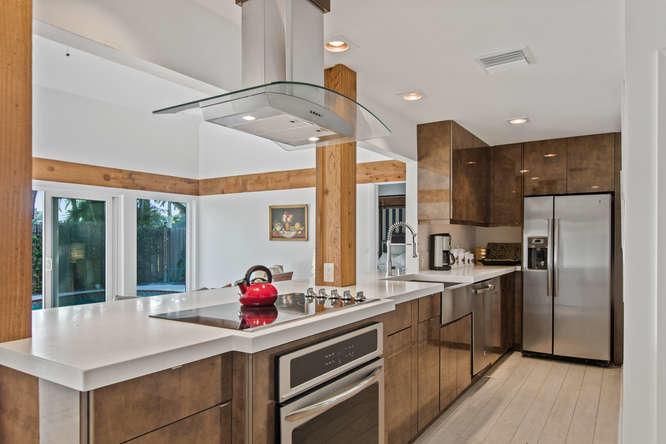 Stunning, completely remodeled and updated bungalow with 2 Master bedroom suites. Plus, small Bonus Room with powder room perfect for guestroom or office. Contemporary, spacious design. New roof in 2018, impact glass, tile through-out. Beautiful pool, pergola and large deck. Walking distance to Palm Beach Polo & Country Club Tennis Facility and the new Idlewild Gym.