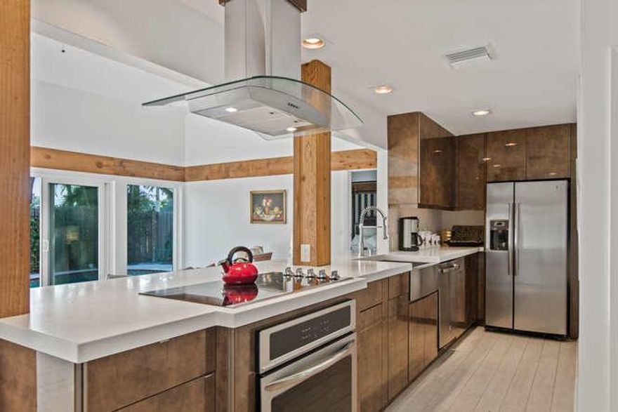 Stunning, completely remodeled and updated bungalow with 2 Master bedroom suites. Plus, small Bonus Room with powder room perfect for guestroom or office. Contemporary, spacious design. New roof in 2018, impact glass, tile through-out. Beautiful pool, pergola and large deck. Walking distance to Palm Beach Polo & Country Club Tennis Facility and the new Idlewild Gym.