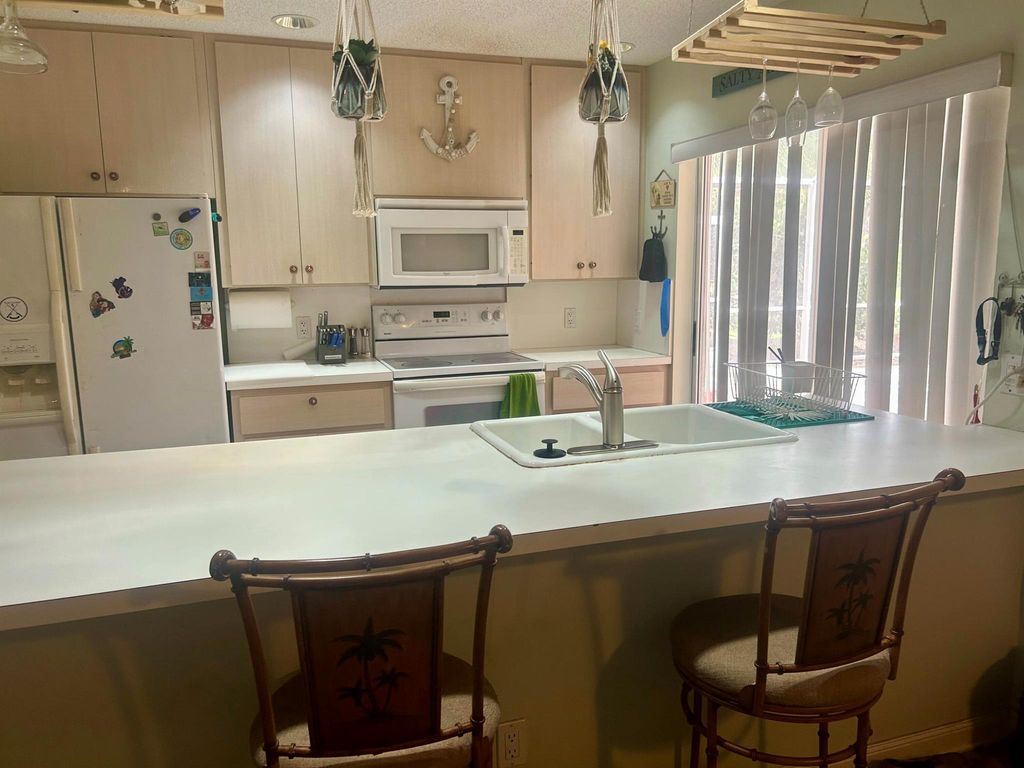 Photo of 901 Sun Terrace Court #A, Palm Beach Gardens, FL 33403 (MLS # R11108094)