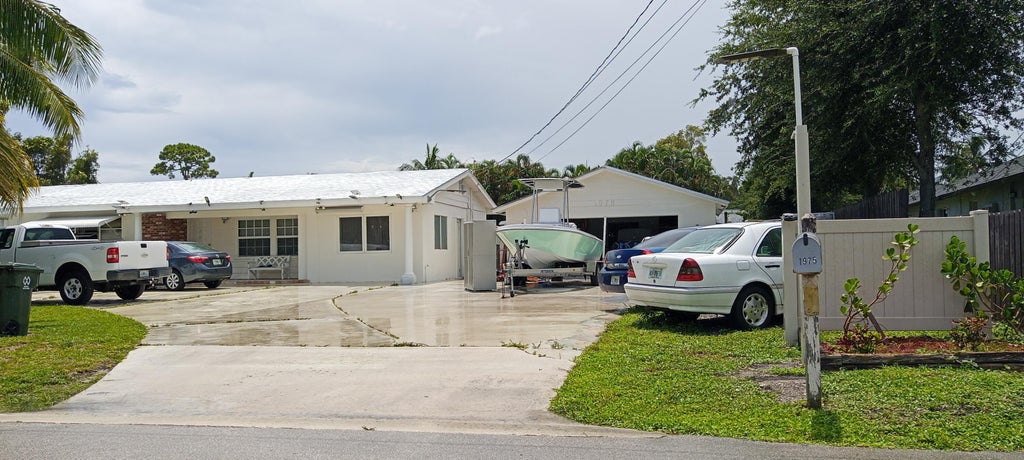 Photo of 1975 Palm Acres Drive, Palm Springs, FL 33406 (MLS # B26091951)