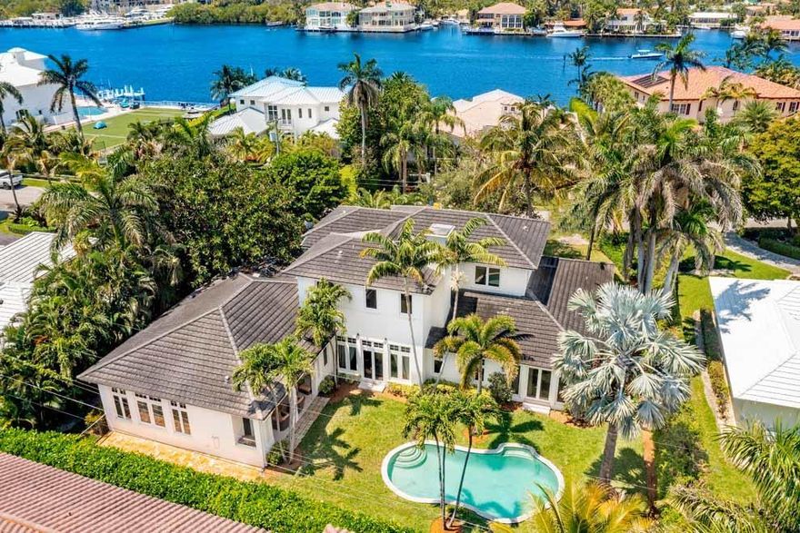 Tucked away in East Delray Beach's desirable Seagate neighborhood, 939 Seasage Dr represents a rare opportunity to enjoy everything that South Florida has to offer. Situated on one-third of an acre with 118 feet of frontage, the property is just a few short blocks from the shops and restaurants of Atlantic Ave and the ocean. Designed by Randall Stofft, the two-story residence features an open floor plan filled with natural light; 12' ceilings; arched doorways; wood and marble floors; first floor master suite with three additional en suite guest rooms; office; expansive circular drive; three-car garage; and pool with expansive fenced yard. Great for year-round living or seasonal enjoyment near the ocean, this is the perfect opportunity to enjoy your very own luxury coastal estate. FEATURES:
" Located in Seagate Neighborhood
" Close to the beach and Atlantic Ave
" 0.33 acres with 118' frontage
" Custom designed by Randall Stofft Architects for current owner
" 4,638 air conditioned square feet / 5,916 total square feet
" 4 bedrooms / 4.2 baths
" Decorative circular drive with ample room for parking
" Open floor plan with high ceilings, natural light and views of the grounds
" Marble and wood flooring
" Foyer entry leads to formal living room with fireplace and access to pool and backyard 
" Formal dining room with abundant natural light
" Kitchen with large island, snack bar seating, abundant cabinets, breakfast area and open to family room
" Family room provides access to covered loggia, pool and grounds
" First floor private office could be used as gym, game room or sitting room
" First floor master suite with access to the pool and grounds; expansive walk-in closet; master bath with dual vanities, whirlpool tub and custom glass shower
" Three additional en suite guest rooms on second floor
" Covered loggia for outdoor living and dining with hook-up for grill
" Pool with plenty of room for lounging and entertaining poolside
" Expansive grounds with fenced yard and green spaces
" Interior and exterior surround sound speakers; security system 
" Two separate garages; south garage is two-car and north garage is one-car with access of front portico; attic storage in both garages

This Seagate offering is ideally located close to the ocean and downtown Delray Beach. With room for residents and guests alike, this is the perfect coastal home for year-round South Florida living or seasonal getaways.