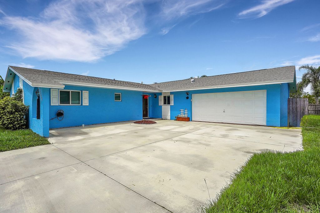 Photo of 2366 SE Corsica Road, Port Saint Lucie, FL 34952 (MLS # R11000238)