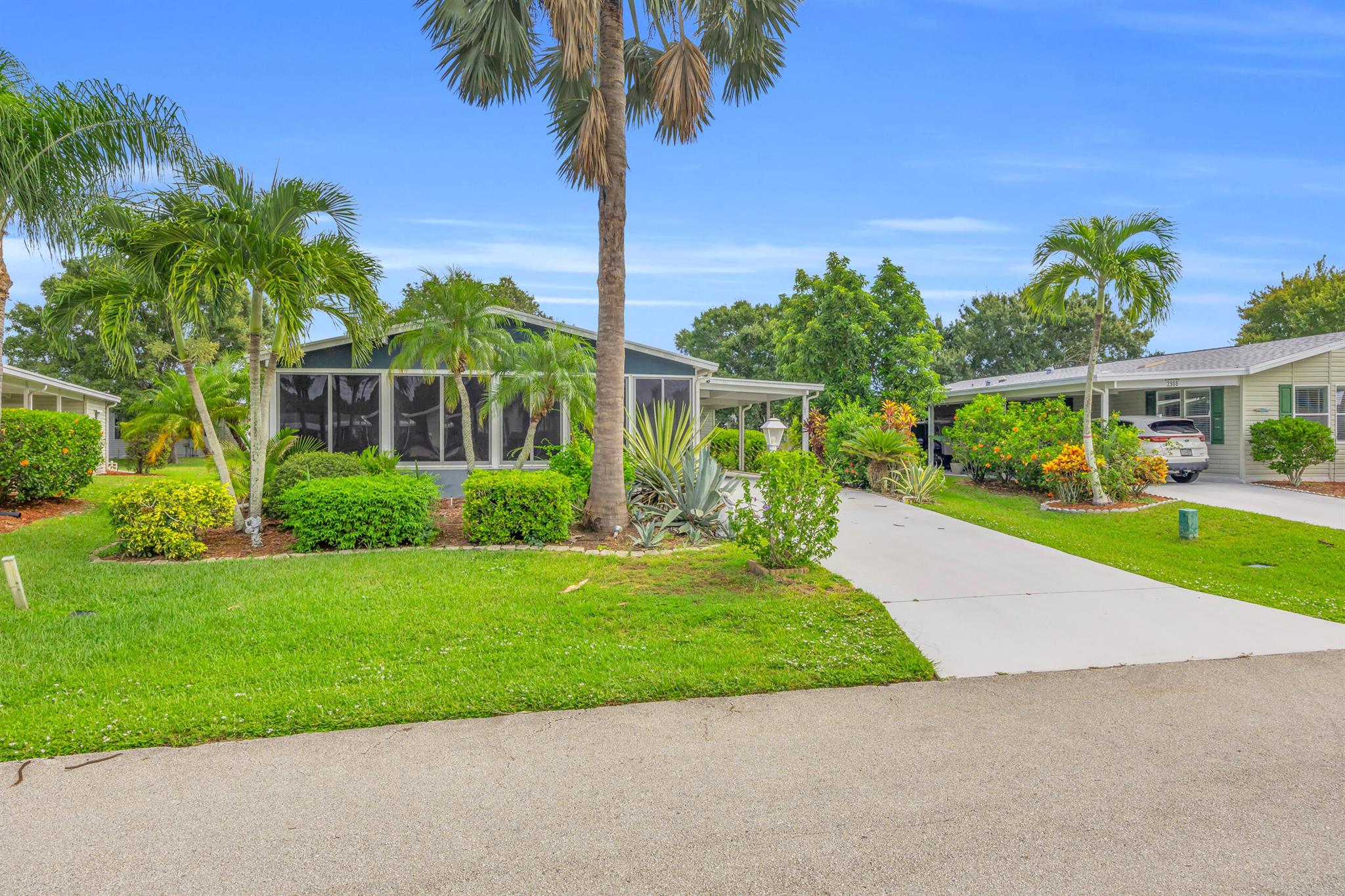 Experience the South Florida lifestyle in the Savannah Club located east of US 1 and close to the beaches, shopping, restaurants and more. This community is built around a golf course with no membership equity requirement. This spacious home features an open living concept and a huge covered patio style area. Home comes with the golf cart (sold AS IS) and features a separate shed that's almost the size of half a 1 car garage.. Savanna Club offers 3 clubhouses- all with pools and exercise rooms. Also, an onsite restaurant and theater. Sold Furnished/Turnkey. Landscaping is not included in the HOA fee. Land lease fee may increase with new owner.