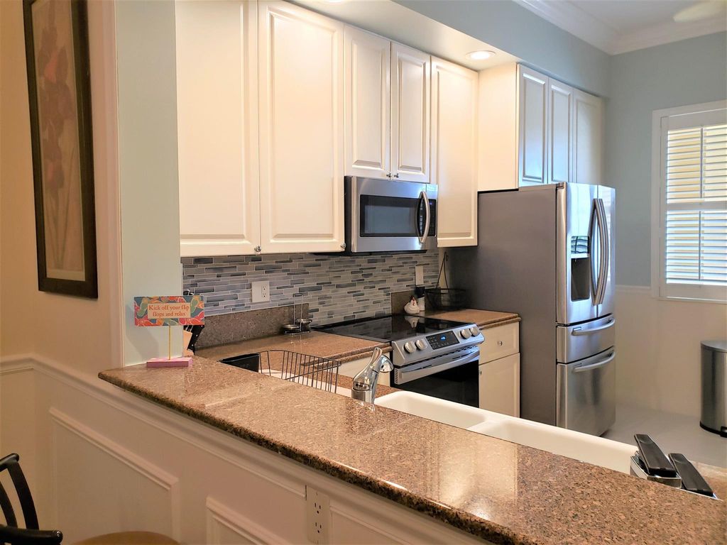 Photo of 37 Harbour Isle 203 Drive E #203, Fort Pierce, FL 34949 (MLS # R11104043)