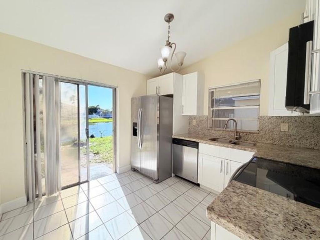 Photo of 13936 Langley Place, Davie, FL 33325 (MLS # F10545624)