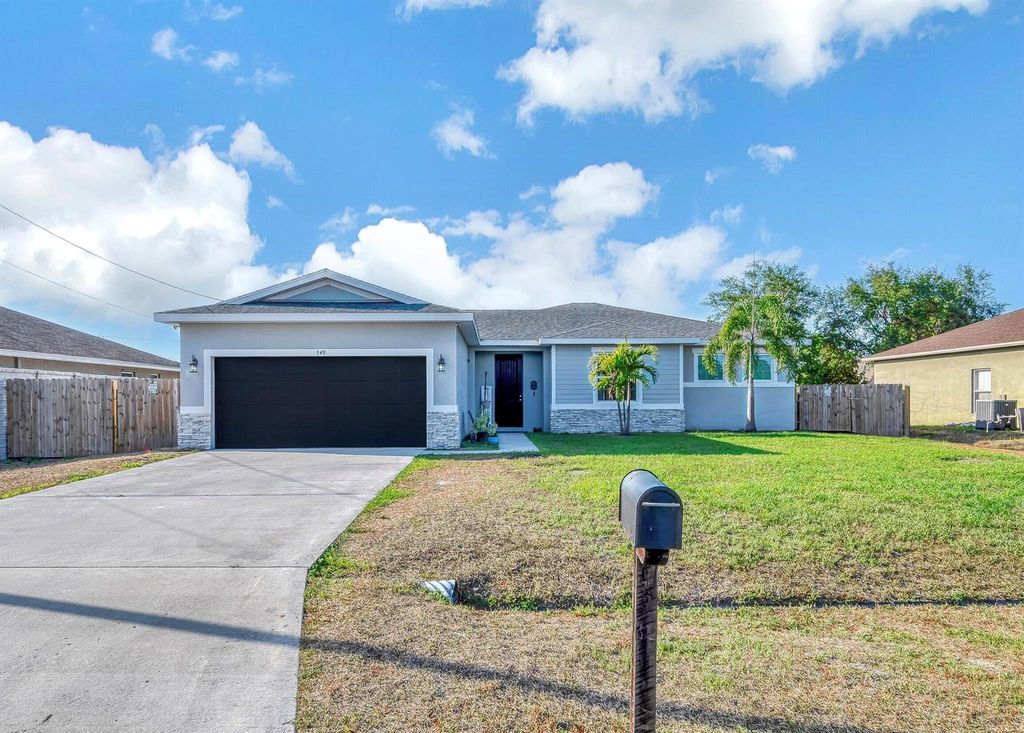 Photo of 549 SW Halkell Avenue, Port Saint Lucie, FL 34953 (MLS # R10985749)