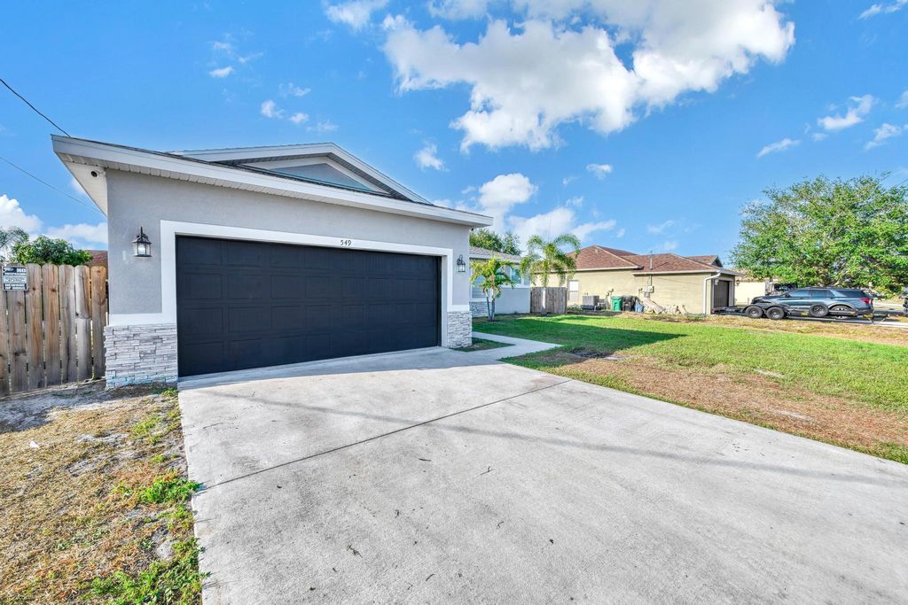 Photo of 549 SW Halkell Avenue, Port Saint Lucie, FL 34953 (MLS # R10985749)