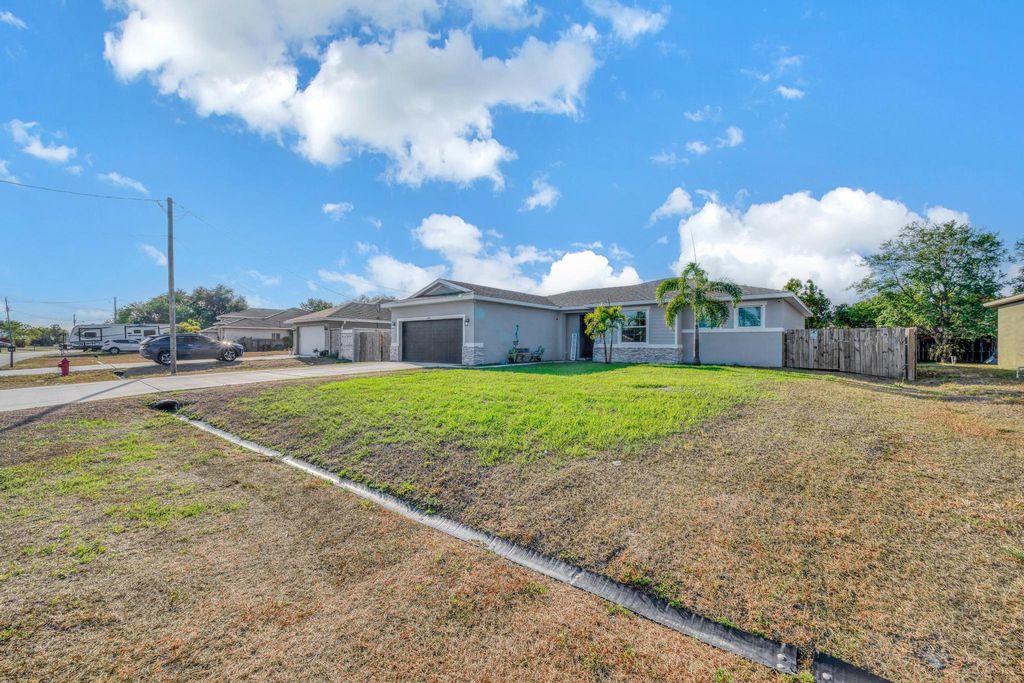 Photo of 549 SW Halkell Avenue, Port Saint Lucie, FL 34953 (MLS # R10985749)
