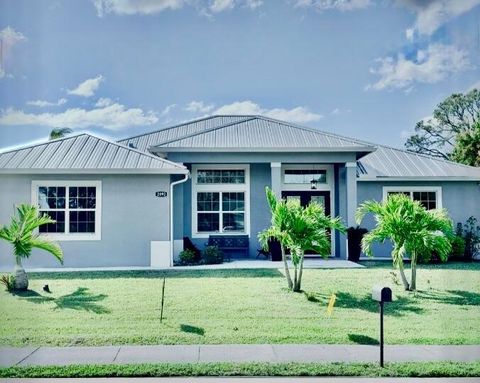 Photo of 2092 SW Airoso Boulevard, Port Saint Lucie, FL 34984 (MLS # R11118038)