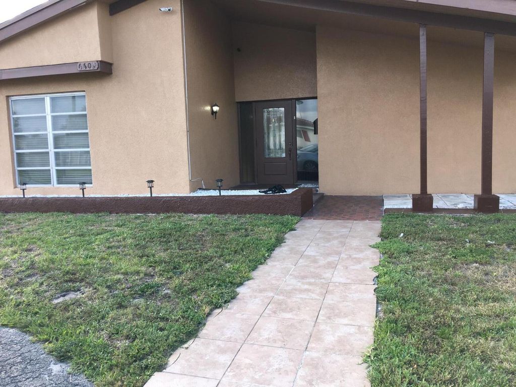 Photo of 6609 Arbor Drive, Miramar, FL 33023 (MLS # B26001566)