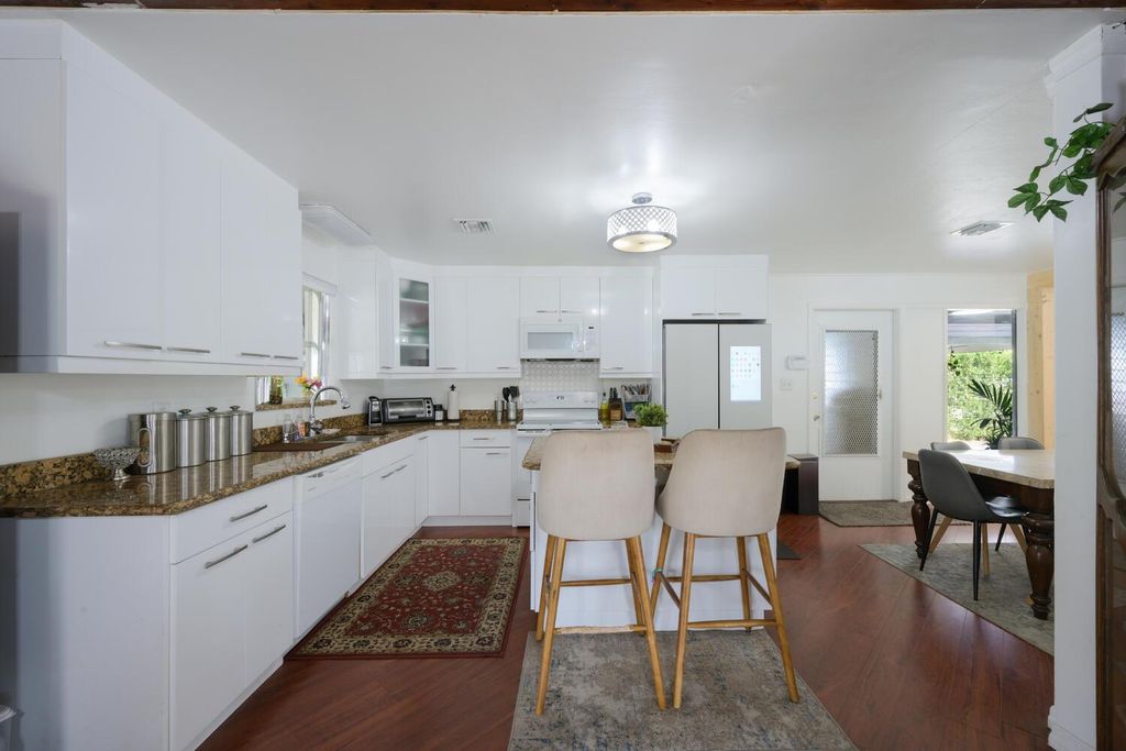 Photo of 509 Virgina Drive, Lake Worth Beach, FL 33461 (MLS # R10942373)