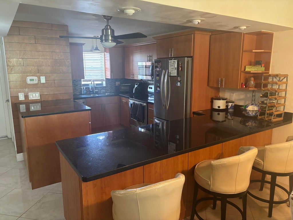 Photo of 2440 DEER CREEK COUNTRY CLUB Boulevard #202-C, Deerfield Beach, FL 33442 (MLS # B26086526)