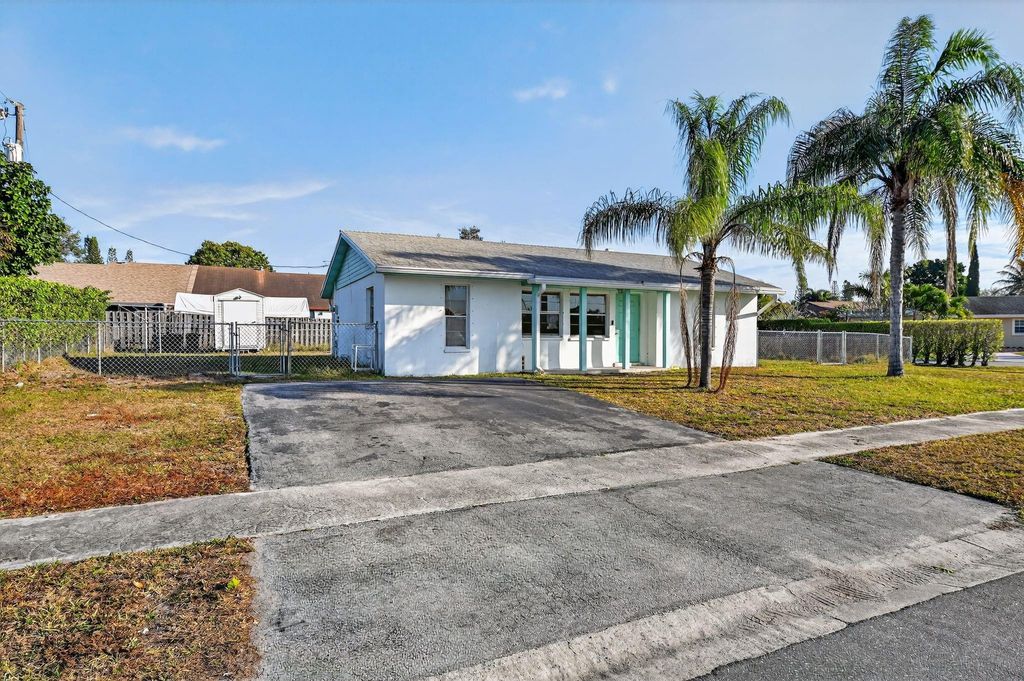 Photo of 5669 S 35th Court, Greenacres, FL 33463 (MLS # F10551809)