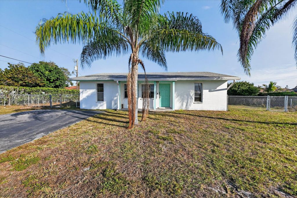 Photo of 5669 S 35th Court, Greenacres, FL 33463 (MLS # F10551809)