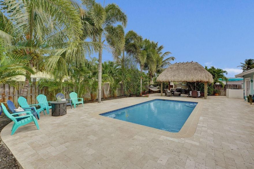 Step into your own private tropical retreat with a large, spacious yard and relaxed coastal charm in the heart of Pompano Beach, one of South Florida's fastest growing hot spots. This beautifully renovated 2 bedroom, 2 bath home offers a warm, inviting feel with a cozy coastal vibe throughout and an open, airy layout. Meticulously maintained with new impact windows, upgraded electrical (2025), A/C (2026), and a 2022 roof. The backyard is your own private Florida escape, ideal for entertaining or unwinding, complete with a tiki hut and updated pool equipment including salt system and heater (2021), plus a new sprinkler pump (2025). A true move in ready home that blends comfort, style, and effortless South Florida living.