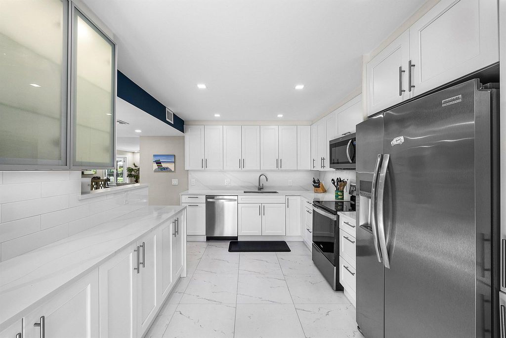 Photo of 3709 Quail Ridge Drive #Bobwhite B, Boynton Beach, FL 33436 (MLS # R11150489)