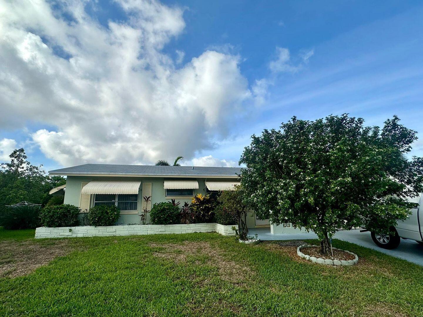 Tamarac Single Family 2 bedroom, 2 bath on a Canal, 55+This charming rental property, located along a peaceful canal, offers two spacious bedrooms and two bathrooms. Ideal for those seeking tranquility and convenience, this home is in a friendly community with access to excellent amenities. The community features a well-maintained clubhouse and two swimming pools. The clubhouse provides ample space for social gatherings and relaxation, while the pools offer opportunities for both exercise and leisure. The property has a full set of appliances, including a washer, dryer, stove, microwave, and refrigerator, making daily chores easy and efficient. The open living area is bright and inviting, with large windows that allow natural light to fill the space, especially in the lanai.