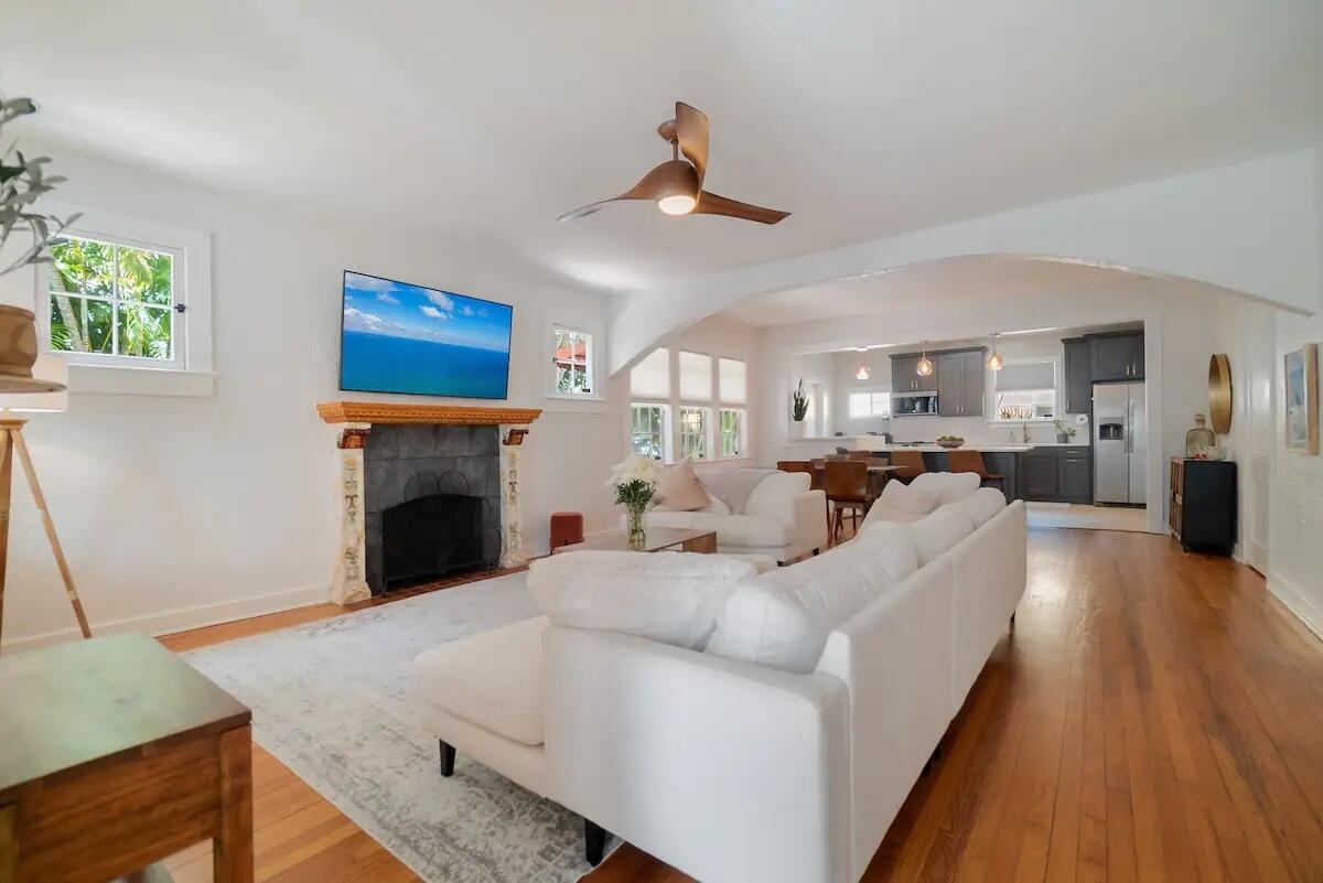 Charming 1920s Spanish home with guest cottage in the highly coveted SoSo neighborhood. The 3BD/1BA main house (1,200 sq ft liv.) features a lovely sunroom, 2021 roof, beautiful hardwood floors, updated bath, high ceilings, fireplace, & a stylish kitchen w/ breakfast bar & gas range. The 1BD/1BA cottage (378 sq ft liv.) offers central A/C, a full kitchen, & a covered patio--ideal for guests or rental income. A long driveway, detached storage garage add convenience. Enjoy a walkable lifestyle, blocks from the Intracoastal Waterway & minutes to restaurants. Close to Palm Beach Island, Downtown WPB, PBI Airport, Brightline, world-class shopping & dining, tennis center, marinas, golf courses, & more.