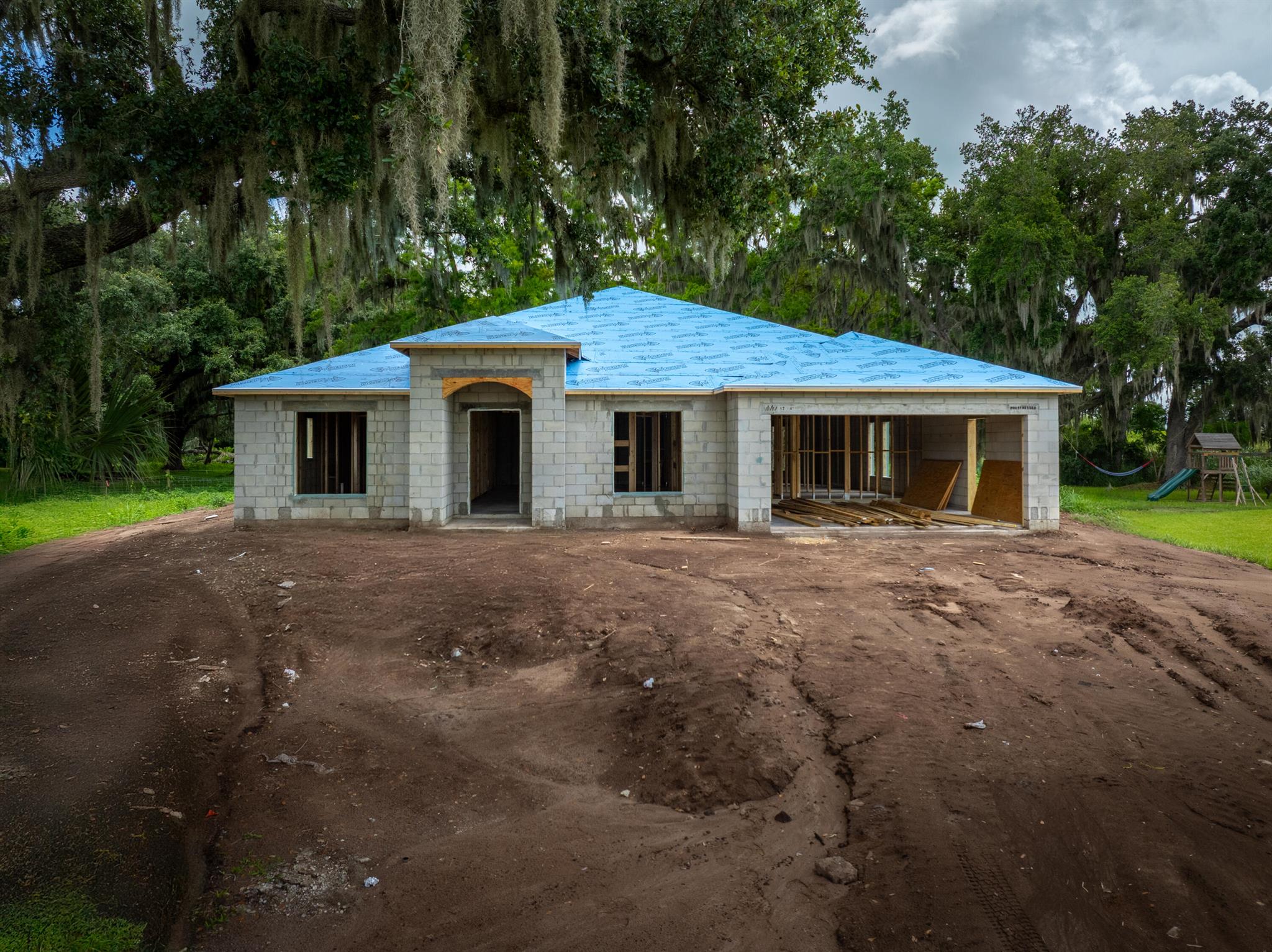 Nestled in the golf community of Blue Heron, this energy‑efficient new build will be completed Fall 2025. Hurricane‑impact windows, foam‑filled block construction with reflective foil insulation and a metal roof set the tone for sustainable comfort. Inside, 2,100 sq ft under AC features 4 beds, 2 baths plus den, a convenient cabana bathroom off the rear patio, granite countertops, vinyl plank flooring, and a spacious walk‑in pantry. Outside, enjoy city water and a large 14,000 sq ft cul‑de‑sac lot--all for a low $25/yr HOA. Schedule your preview today!