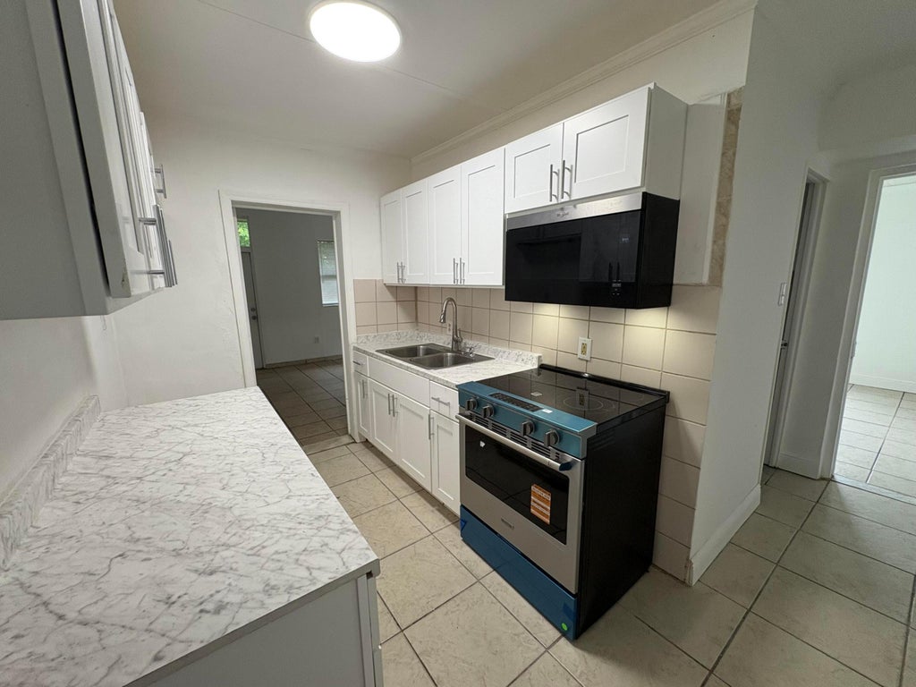 Photo of 1861 BOMAR Drive, Juno Beach, FL 33408 (MLS # B26086739)