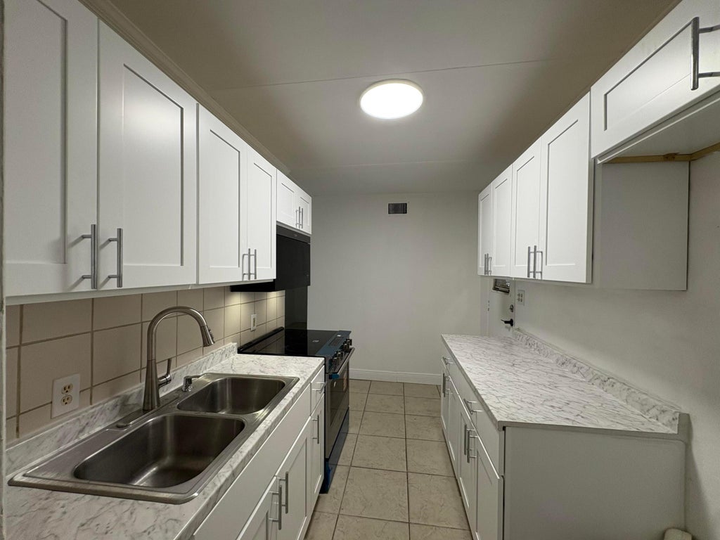 Photo of 1861 BOMAR Drive, Juno Beach, FL 33408 (MLS # B26086739)