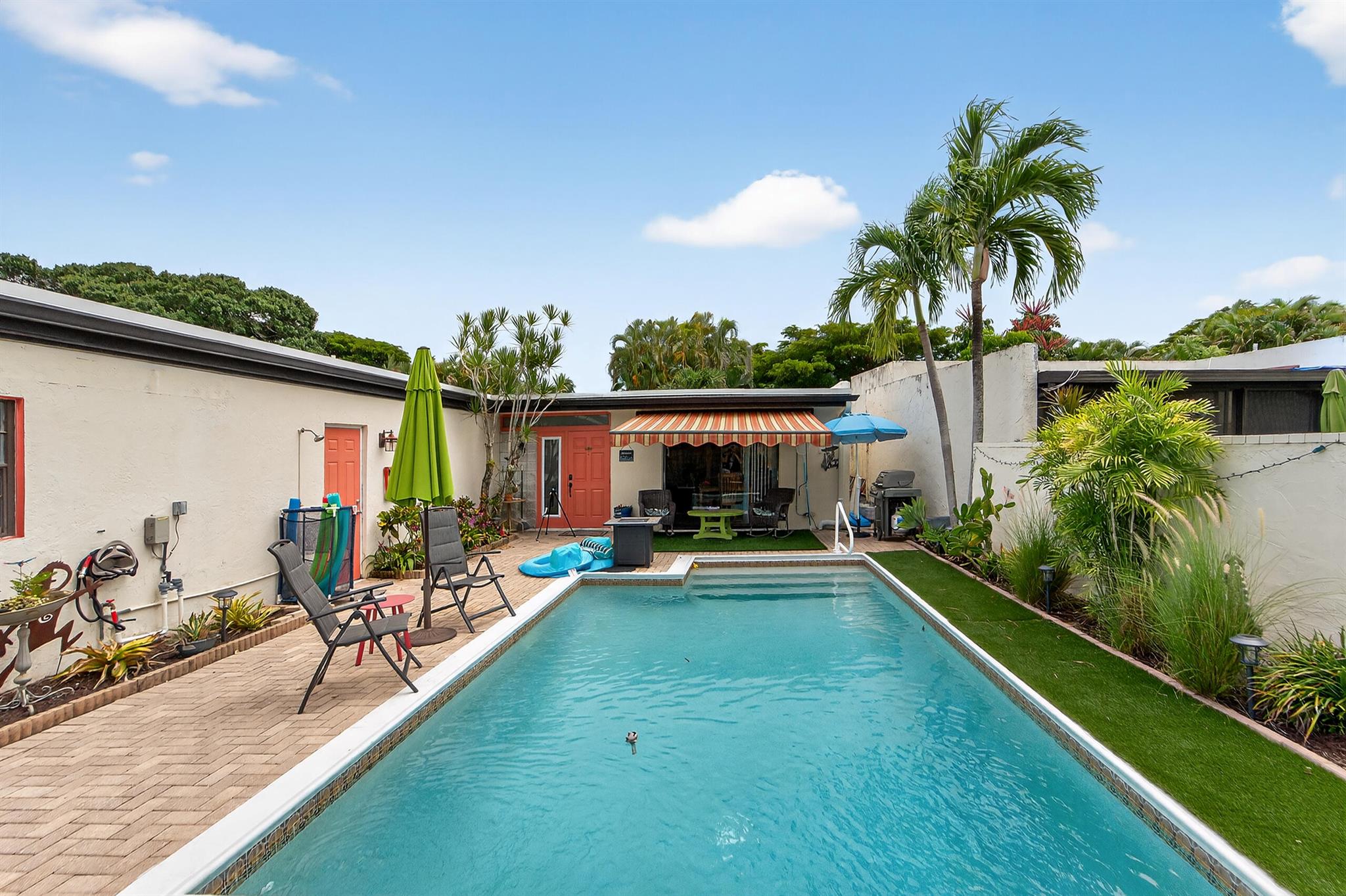 Rare 3/2 POOL villa, located in 55+ gated community Indian Spring. A truly unique find in the heart of Boynton Beach - spacious townhome with it's own private pool. Views of the 16th hole on the golf course. You'll find character and charm at every turn in this home! Roof is only two years old, AC only one year old. Storm protection panels throughout. Saltwater pool. Real working fireplace. The kitchen offers abundant cabinet space, granite countertops, and stainless-steel appliances. Dining and living areas flow seamlessly for entertaining. Primary bedroom features golf course views and direct access to outdoor space. Large court yard with a salt water pool, lush tropical landscaping, lots of area for relaxing or hosting. Close to beaches, shopping and dining.