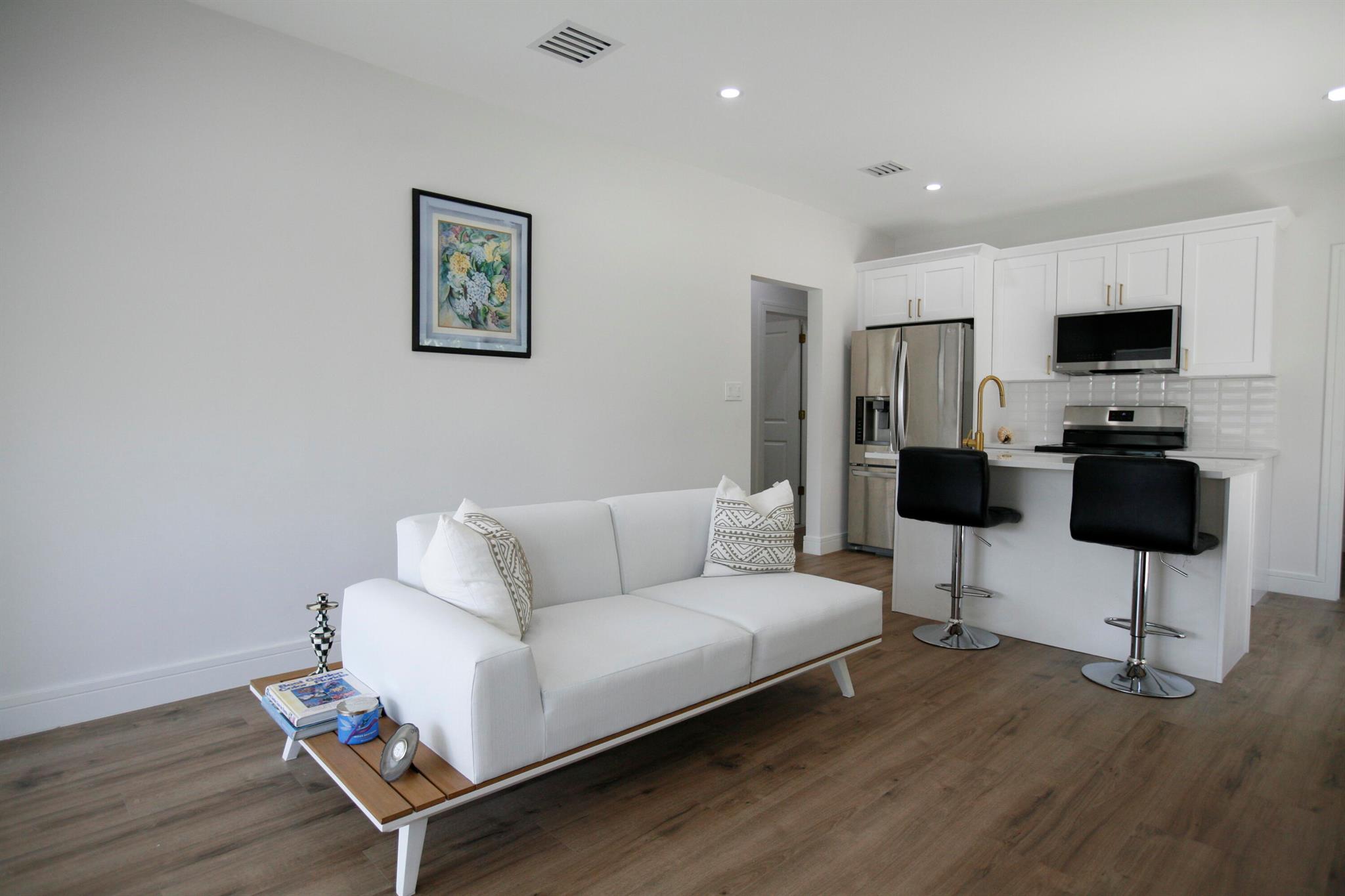 Stunningly Renovated Utilities included 3/2 Gem in Prime Lake Worth Beach Location Welcome to this unbelievable beauty in the heart of Lake Worth Bch, just mins from sparkling shorelines, vibrant downtown, & w/seamless access to I-95 for a quick commute anywhere in PB County. This exquisitely renovated home is the perfect blend of charm & modern luxury. Fully remodeled w/top-of-the-line finishes & elegant upgrades throughout, this home is ideal for a small family or busy professionals. One of the bedrooms easily transforms into a stylish home office, offering flexible space for today's lifestyle. Step inside & fall in love w/the home's timeless character, featuring a cozy fireplace in the living room. Schedule your private showing today & experience luxury living just mins from the beach.