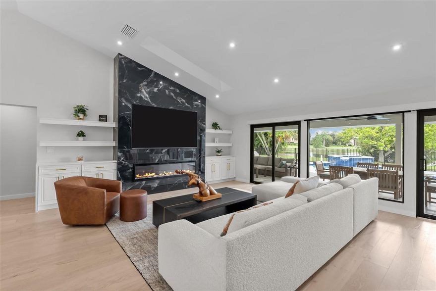 Discover a rare lakefront gem in this fully remodeled 4-bedroom, 3.5-bath home with new high-end finishes throughout. Located in the prestigious Bay Hill Estates, an exclusive 18-hole golf community with no membership required. Enjoy a chef’s kitchen with premium finishes, custom wall built-ins, and a spacious living room featuring a fireplace and wet bar. The master suite offers lake views and access to the community’s only private fishing dock. Step outside to an outdoor retreat with sunny southern exposure and a full summer kitchen, heated pool, and hot tub. A custom garage, EV charger, 24-hour security, low HOA, and a brand-new 2024 roof. Conveniently located near PGA and shopping, this property is move-in ready offering the ultimate Florida lifestyle without the need for renovations.