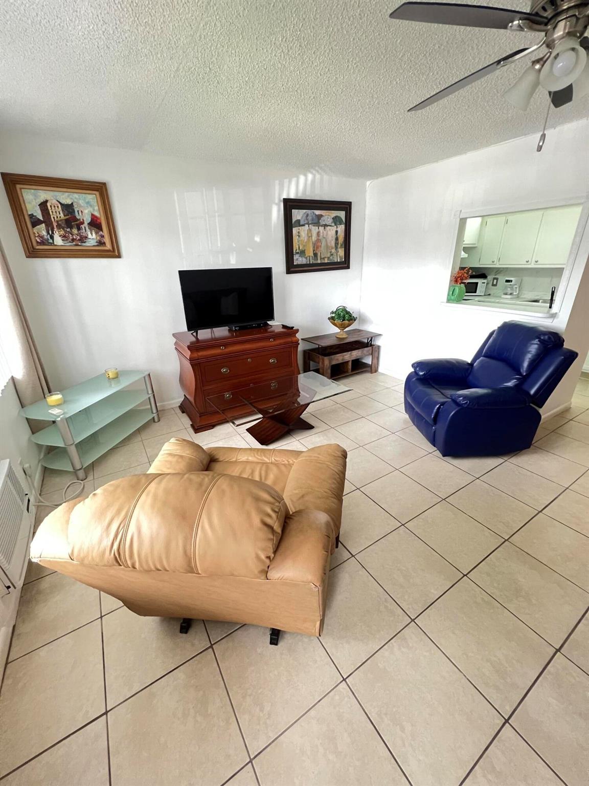 55+ age restricted gated community. Great first floor location, park just steps from your entry. Nicely updated with ceramic tile throughout and tastefully furnished. Unit has 2 a/c units. Many amenities, walk to pool.