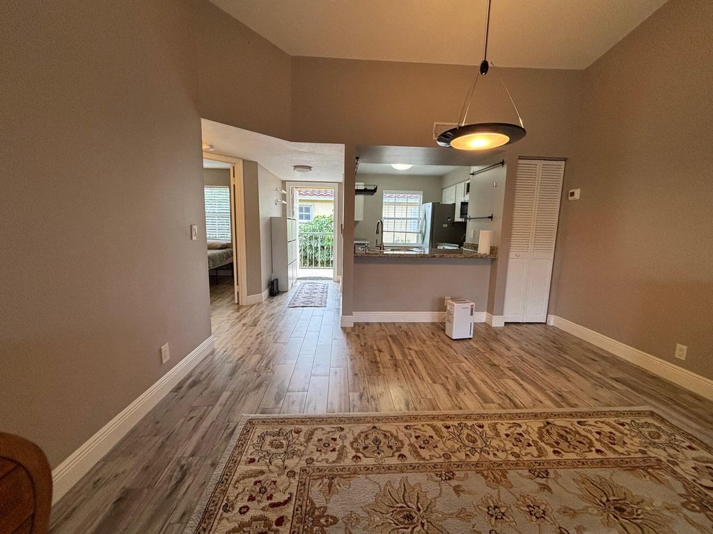 Photo of 1035 Lake Shore Drive #202, Lake Park, FL 33403 (MLS # R11159157)