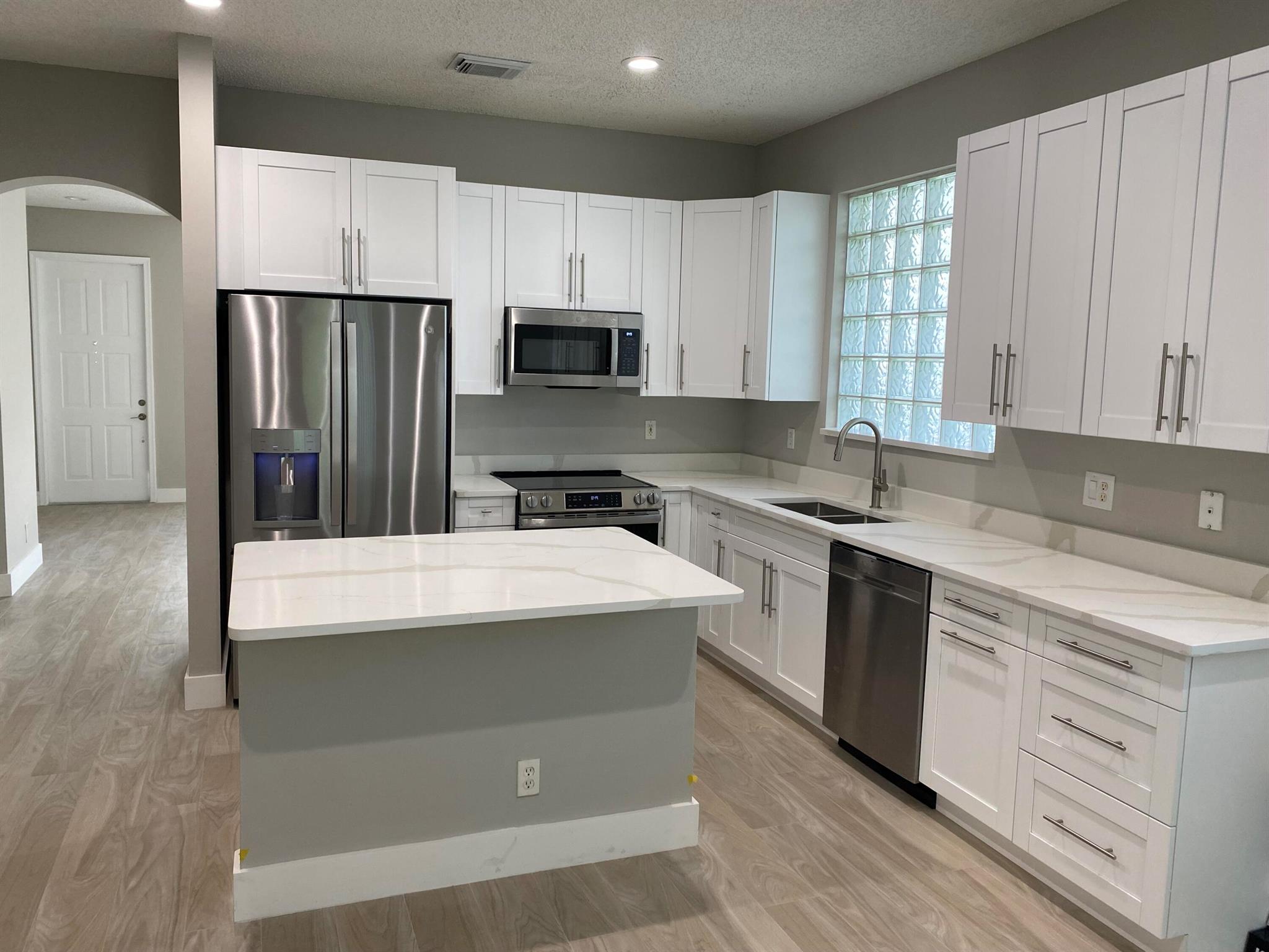 COMING SOON!!! Wonderful GATED Community! NEWLY RENOVATED! Open & Spacious, High Ceilings, Formal Living & Dining Rooms, Brand New White Shaker Kitchen, New Quartz counters, New Appliances and Kitchen Island, that opens to a LARGE Family Room. Porcelain & Ceramic Tiled Floors thruought, (No Carpet) & Fully Fenced Backyard & Lawn Care is Included. Enjoy Friendly All Ages Community w/ Clubhouse, Pool & Fitness & Playground! Need FICO 725+, Non-Smokers, No Pets/Animals.
