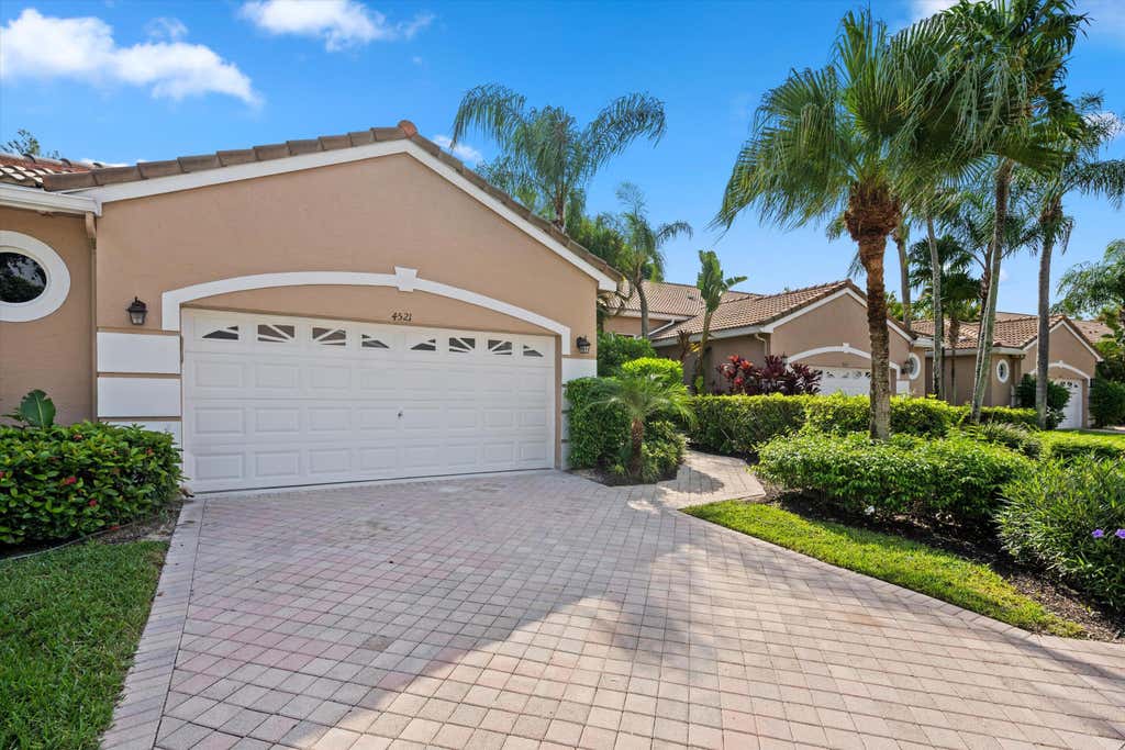 Photo of 4521 CARLTON GOLF Drive, Lake Worth, FL 33449 (MLS # B26055401)
