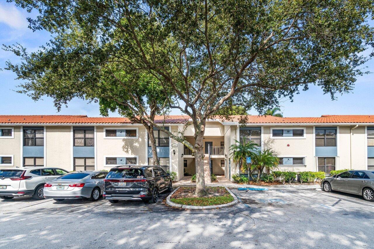 Welcome to Palm Beach Grande! This well-maintained 2 bedroom, 2 bathroom corner condo offers both comfort and convenience in a highly desirable location. Inside, you'll find a spacious layout with tiled living areas, wood cabinetry, granite countertops, and stainless steel appliances. A washer and dryer are included in the unit for everyday ease. Step out onto your private balcony and enjoy peaceful water views, the perfect spot for morning coffee or unwinding in the evening.Palm Beach Grande residents enjoy a wide range of amenities including a clubhouse, fitness center, swimming pool, tennis courts, basketball, playground, and on-site laundry facilities. The community is centrally located near the Turnpike, Wellington, shopping, dining, and top-rated schools all within close