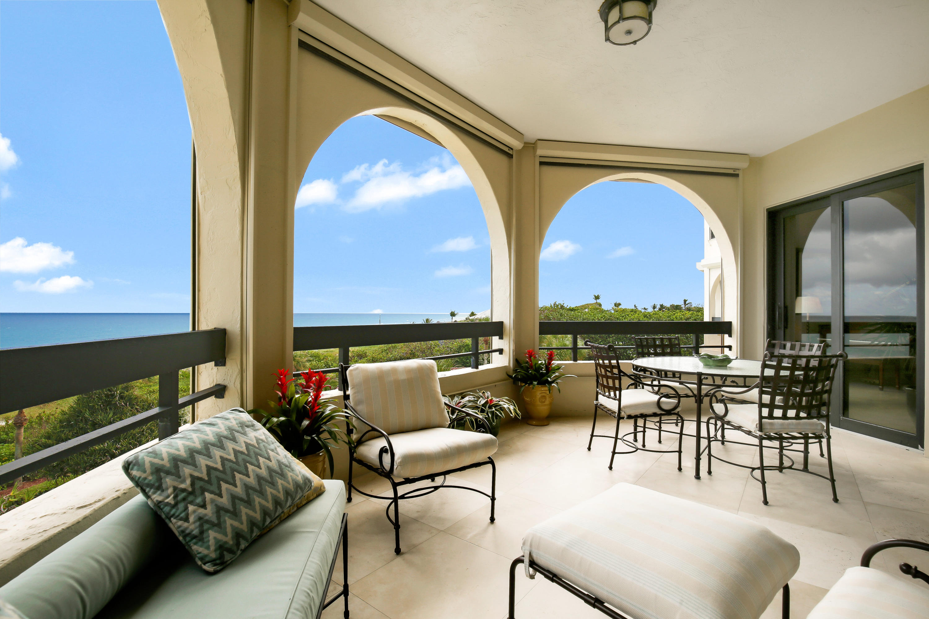 Panoramic ocean views abound from this lovely updated apartment in a boutique building of only 24 residences. Offering 3,270 total square feet with private elevator landing opening to a formal foyer the unit boasts a large great room a cozy den with fireplace, formal dining room and wet bar all with extensive east and south ocean views.  Bringing delight to any chef is a masterfully styled gourmet kitchen with island, top grade cabinetry and state of the art appliances. With three perfectly appointed bedroom suites, sumptuous master suite with unobstructed ocean vistas, two indoor parking spaces, extra storage, impact windows, this unit is a true gem.  Located in El Cortijo one of the most sought after buildings in Gulf Stream close to all Palm Beach County has to offer.