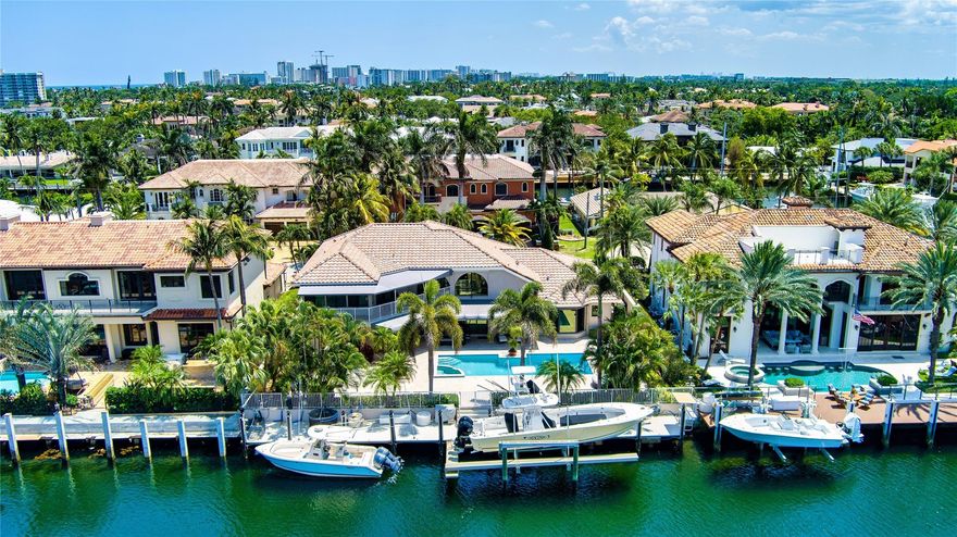 Remarkable Deepwater Estate sited on 100’± of waterfrontage on the wide Flamingo Canal in sought-after Lighthouse Point on a rare island street. This classic estate reveals 4 beds, 4.1 baths & 4,236 Total SqFt. Impressive double height foyer opens to the re-imagined light-filled interiors. Each level encompasses a primary waterfront suite & garden front guest suite all with updated en-suite baths. Gourmet kitchen w/custom cabinets & Wolf/Subzero appliances. Other amenities include 2 Bay Garage, Impact Windows, 3 zone A/C, custom walnut built-ins & security cameras. Outdoor entertainment is enjoyed at the sun-splashed pool secluded in lush landscaping. For boating enthusiasts, there is a full service 90’+/- brock dock complete with 20,000lbs boat lift just minutes from the Hillsboro Inlet.