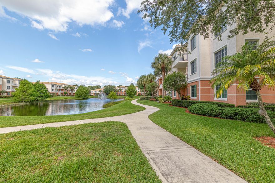 This lovely 3 bed, 2 bath unit on the first floor is located at Fiore (often dubbed "Palm Beach Gardens hidden treasure").Enter into an open floor plan to the living area with tile floors, crown molding, and chair rails all around.The EXTRA room offers plenty of options for use. Updated kitchen, laundry area, bright, plenty of work and storage space, newer appliances. Backdrop tile and counter tops are identical in the dining room storage area with cabinets on top and bottom and a counter the entire length of the wall. The master suite is private and spacious, boasting a walk-in closet with plenty of room for storage. The 2nd bedroom has a built-in Murphy bed unit with built-in book shelves on both sides, and a walk-in closet.The 3rd bedroom can accommodate a bunk bed, and wrap around furniture still leaving plenty of  space in the middle.  Both bathrooms are spacious, with extra large tubs, and lots of counter top area.  Other features include indirect lighting in the kitchen and dining area, censor light switches in  most of the unit, and laminate floors in all bedrooms.