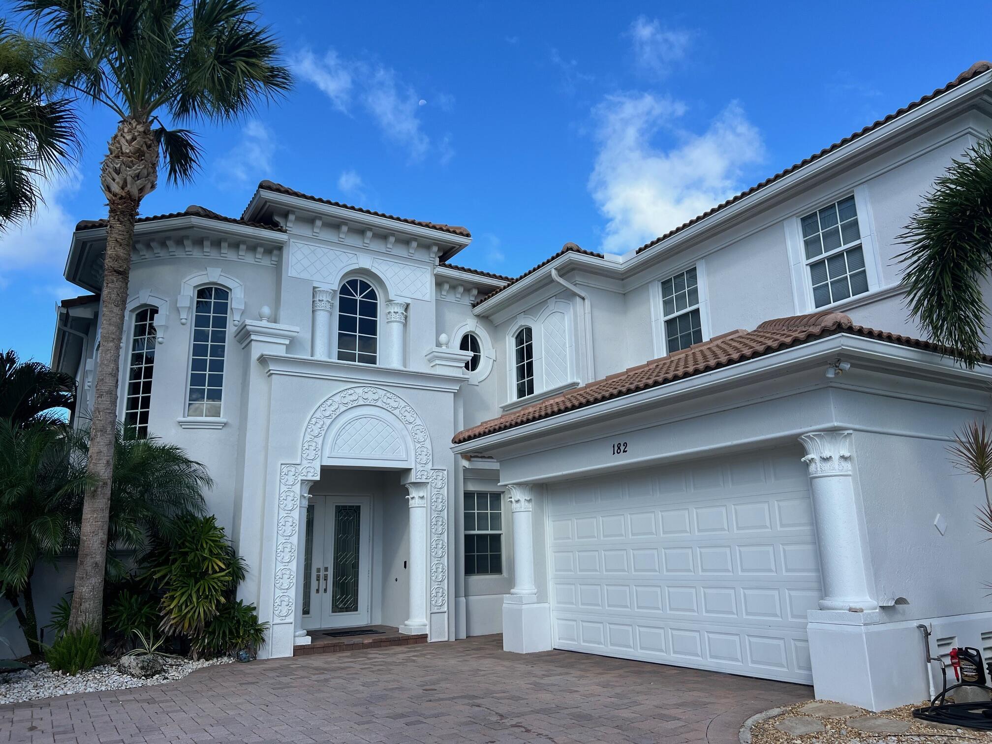 This luxury home is light and bright with 20' ceilings and expansive views throughout (golf course & preserve). Among the largest lots (1/2 acre) in Jupiter Country Club, it offers complete privacy for your serenity. Updated, chef's kitchen has a 10' quartz center island and premium appliances (natural gas range). Marble in main living & master bath and high-end LVP in bedrooms and loft. Oversized, screened patio boasts a summer kitchen (S.S. gas grill, refrigerator, sink), pool & multiple areas for entertaining guests. Expansive views are perfect for watching the sunrise and sunset! First floor master has a sitting/reading area and a huge custom walk-in closet. Jupiter Country Club is convenient to beaches, nature preserves, dining, shopping, & cultural venues.