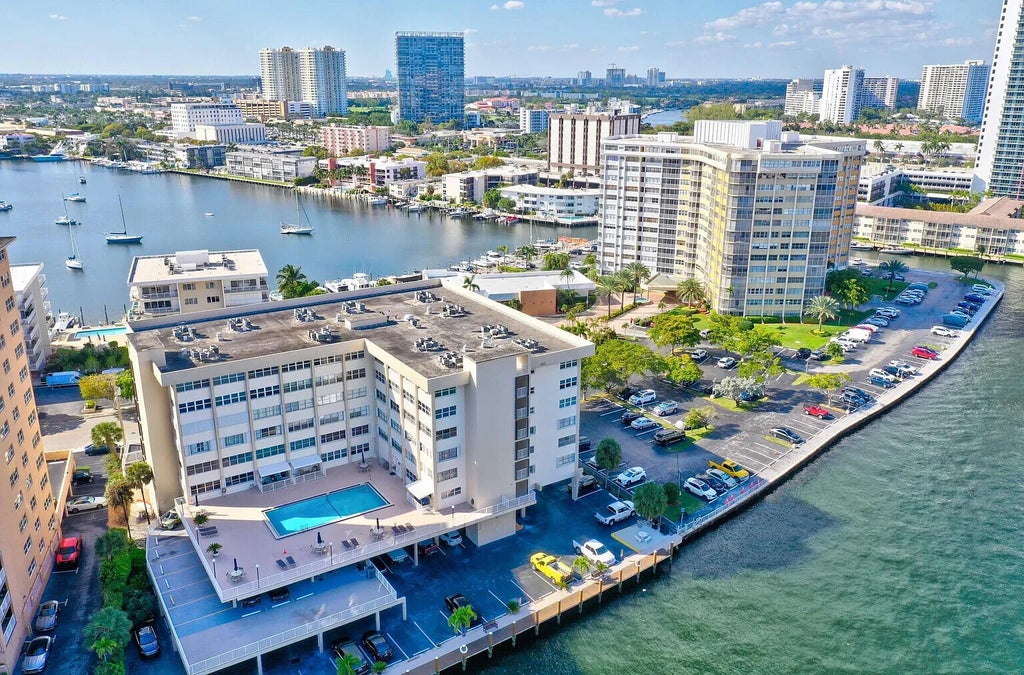 Photo of 111 Golden Isles Drive #D2, Hallandale Beach, FL 33009 (MLS # B26092513)