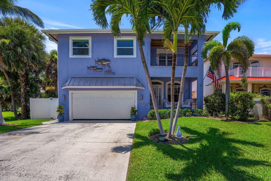 Great PRICE IMPROVEMENT. Best location near the beach, restaurants, bars and the famous Fort Pierce Inlet. Unique Key West style custom home with 3 covered balconies, island views & custom smart features. Solid concrete construction, heavy-duty standing rib metal roof, good elevation one block from the beach. Enter into a separate living area which opens into a large great room with soaring 20 ft ceilings. A chefs kitchen with oversized butlers pantry. Two primary bedrooms, one downstairs with its own private en suite and a walk out to the tropical garden; one upstairs with its own separate living area, private balcony that faces the ocean, huge walk-in closet and private en suite. Also upstairs, a guest bedroom w/ separate bath, and another large balcony that views the tropical backyard.