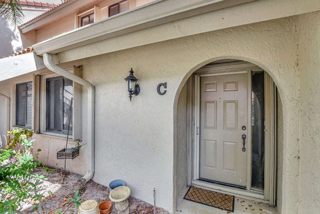 Photo of 5640 Coach House Circle #C, Boca Raton, FL 33486 (MLS # B26050417)