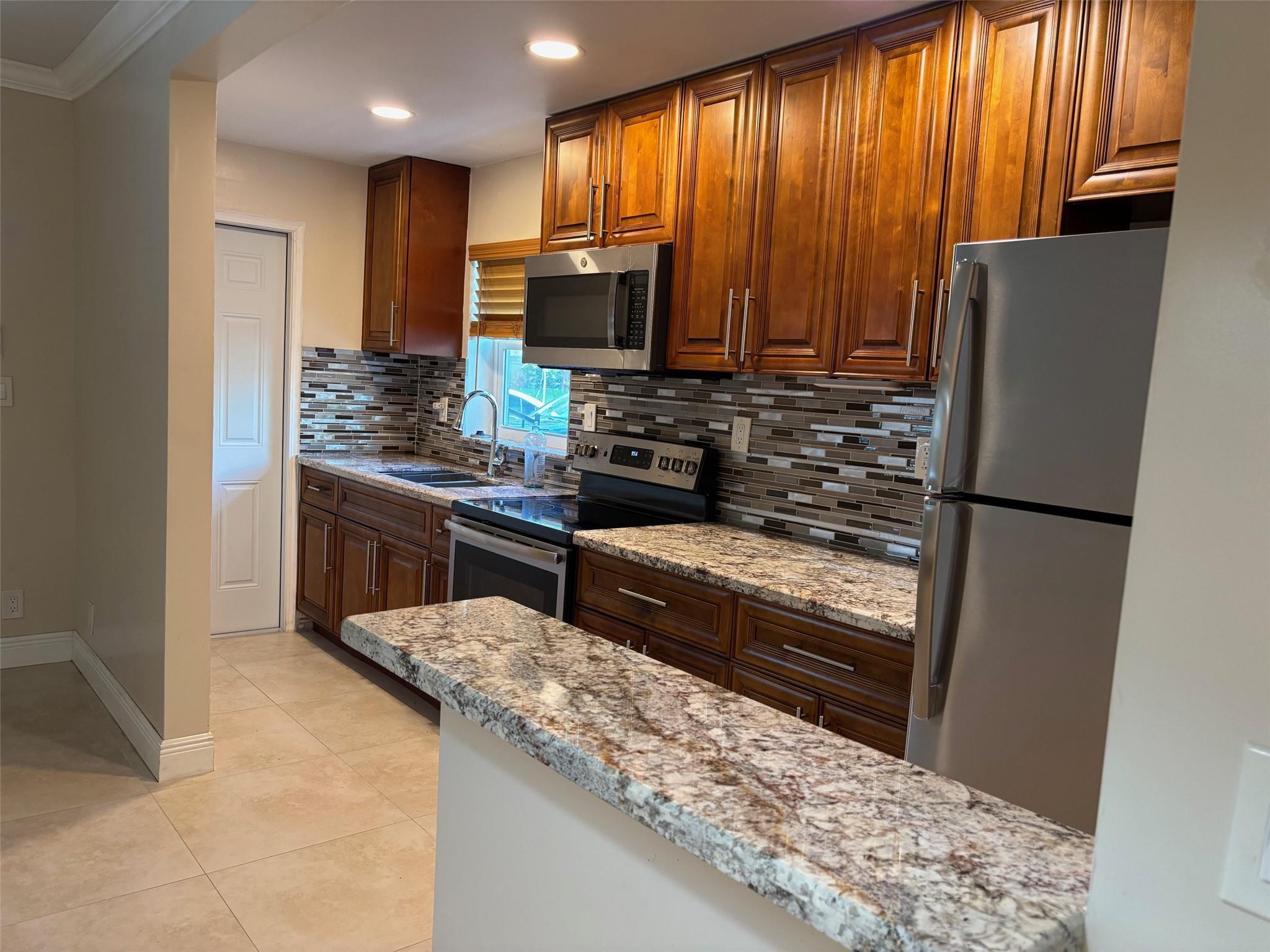 Don’t miss this rare opportunity to own in a quiet, sought-after community! This fully updated 2-bedroom, 1-bath home features tile flooring throughout, a stunning brand-new kitchen, and a modern walk-in shower. The pool is just steps from your front door, and the laundry room is conveniently located on the second floor.
Walk to LA Fitness, Aldi, and the Pompano Beach Tennis Center — all while living in a peaceful, tucked-away neighborhood close to everything. Move-in ready and 30-minute walk or 5 minute drive to the beach!