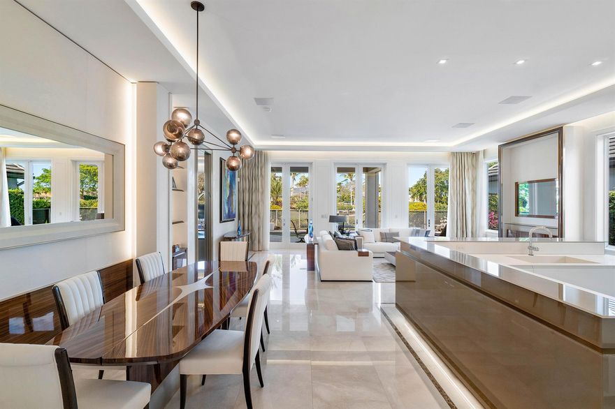 Indulge in the epitome of luxury living within this magnificent ''built from the ground up'' modern Italian-styled home. From the moment you step inside, you are immediately impressed by the elevated grandeur of each room. This residence is a masterpiece of design, seamlessly blending an open-concept layout with high end aesthetics throughout. The family room overlooks a picturesque back patio, adorned with a pool with a sunken spa and lounge area, offering unparalleled relaxation. Seamlessly incorporated is the most spectacular kitchen where Miele appliances are hidden behind custom Italian cabinetry that continues to impress behind each door. All the elegant details of this home including the architectural marvel of the lighting are like no other. The primary suite is an oversized ------
