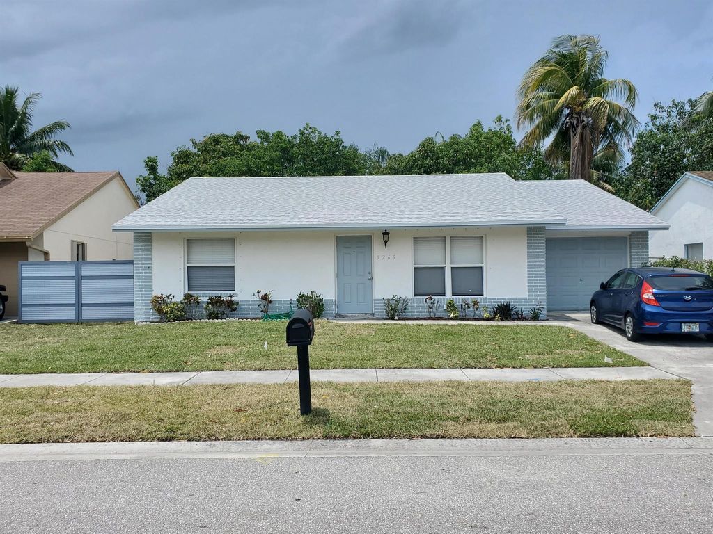 Photo of 5769 Ellis Hollow Road E, Lake Worth, FL 33463 (MLS # R11088673)