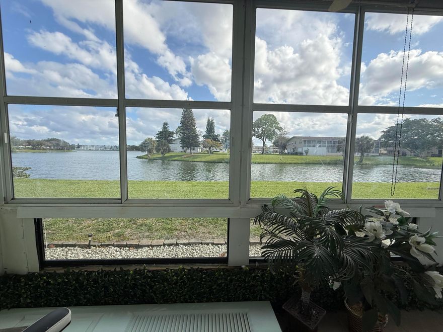 TURN THIS GROUND FLOOR 1BED/1.5 CONDO WITH AMAZING WATER VIEW INTO YOUR PRIVATE PIECE OF PARADISE. LOCATED IN CENTURY VILLAGE A GATED COMMUNITY FOR ACTIVE ADULTS 55+   WHITE CERAMIC TILE FLOORING THROUGHOUT, OPEN CONCEPT KITCHEN, LANAI WITH NEW WINDOWS, TILED FLOOR AND A DOOR THAT OPENS TO THE GRASS. TAKE IN THE BEAUTIFUL WATER VIEW FROM THE LARGE BEDROOM AND THE LANAI OR SIT OUTSIDE AND ENJOY THE FRESH AIR. SHORT WALK TO THE C COMLUBHOUSE AND HASTINGS FITNESS CENTER.COME AND ENJOY RESORT STYLE LIVING IN THIS GATED COMMUNITY FOR ADULTS 55+. Clubhouse with theater, shows, movies, craft and card rooms, billiards, aerobics, yoga, and dance classes. Numerous heated outdoor pools throughout the community. Separate fitness center with gym , outdoor pool, Separate fitness center with gym , outdoor heated pool , sauna , exercise classes and a resistance pool. Two guarded gates and 24 hour roving security patrol. GREAT LOCATION: close to shops, restaurants, PBI airport and beaches