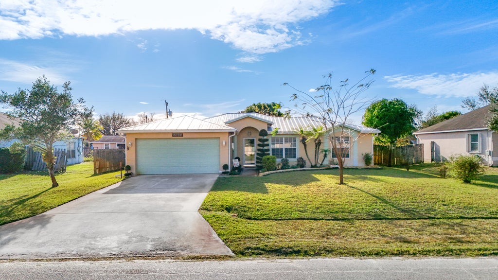 Photo of 2038 SW Libra Lane, Port Saint Lucie, FL 34984 (MLS # R11157344)