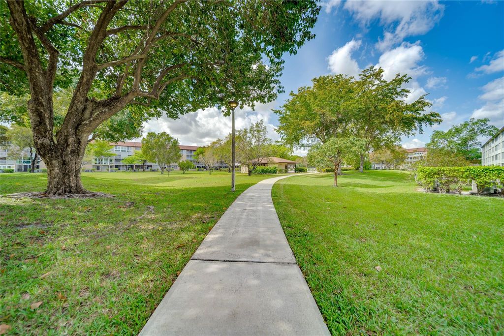 Photo of 13250 SW 7th Ct #303-L, Pembroke Pines, FL 33027 (MLS # F10533953)