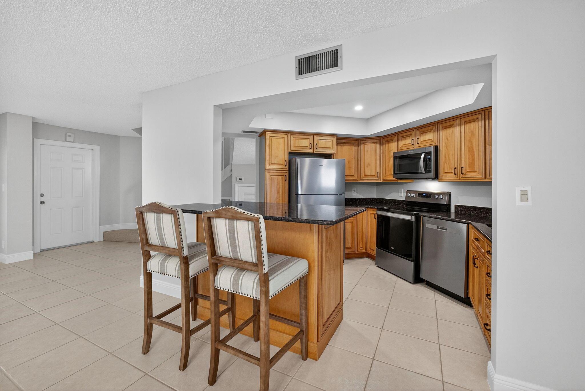 WALK TO THE BEACH ON A PRIVATE DEEDED WALKWAY.Lovely, Clean and Spacious (1,620 Sft)3Bedroom ,2Full Bath,1 Half Bath Condo/Town currently for SALE in the Seaside Community of Seabrook Place,Jupiter. Property RECENTLY went through RENOVATIONS ($35k). BRAND NEW Carpet(stairs and 2nd floor only) FULL BATHROOMS REMODELLED:NEW TILE,TUB ,SHOWER,CABINETS, FLOORS, FAUCETS. INTERIOR FRESHLY PAINTED .NEW RECESSED LIGHTING in Kitchen. NEWER SS Appliances(2025). WASHER/DRYER (2023). Newer light fixtures. A/C(2022). HURRICANE SHUTTERS throughout. Rarely available Most EASTERN Location of the Community, adjacent to a Peaceful Preserve. Seabrook is a GATED community,close to Shopping.As per the association:Basic Cable+one upgrade, 2 front assigned parking spots+Guests. RENTABLE AFTER PURCHASE.Pets ok.