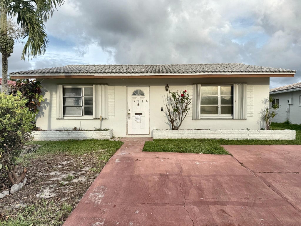 Photo of 5718 NW 86TH Terrace, Tamarac, FL 33321 (MLS # B26089380)