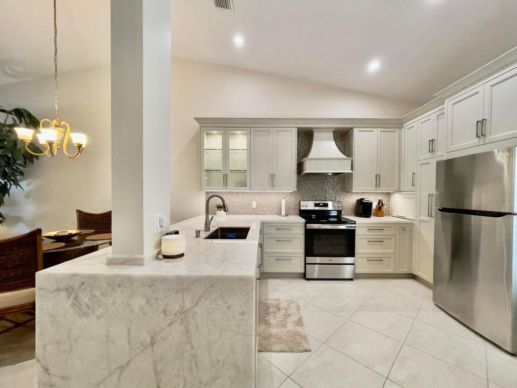 Photo of 202 Cypress Point Drive #202, Palm Beach Gardens, FL 33418 (MLS # R11161989)